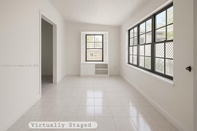 3015 SW 24th Ter, Miami, FL 33145 - unfurnished room with light tile patterned floors and wood ceiling