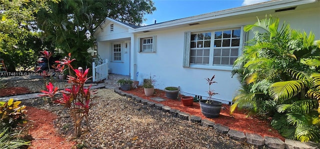 exterior space featuring stucco siding
