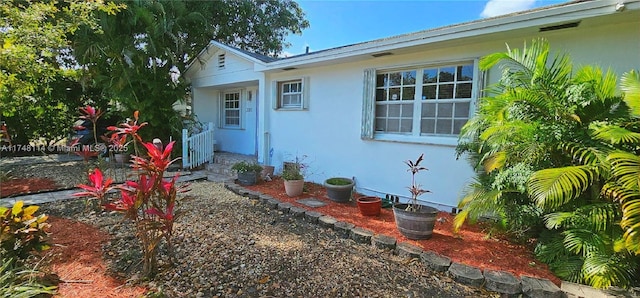 exterior space featuring stucco siding