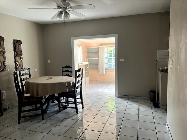 dining space featuring light tile patterned floors and ceiling fan