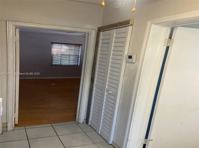 hallway featuring light tile patterned flooring