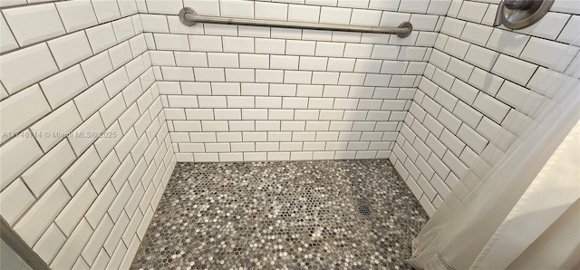 full bathroom with tiled shower