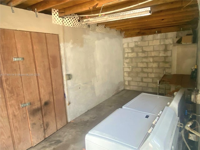 below grade area featuring separate washer and dryer