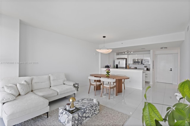 living area featuring light tile patterned flooring