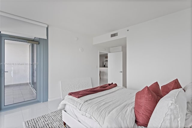 bedroom with visible vents and light tile patterned flooring