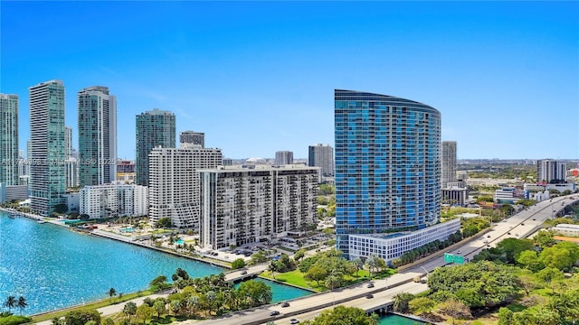 bird's eye view featuring a water view and a city view