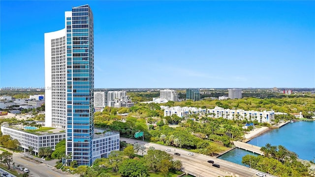 drone / aerial view featuring a water view and a city view