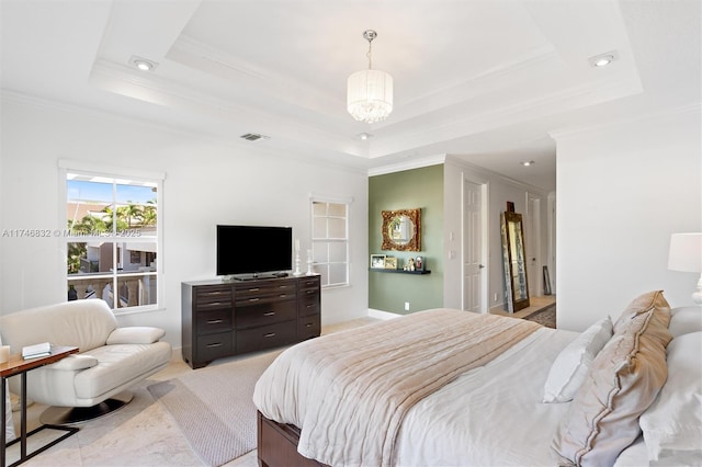 bedroom featuring ornamental molding, a raised ceiling, and visible vents