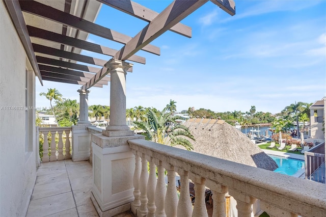 balcony featuring a pergola