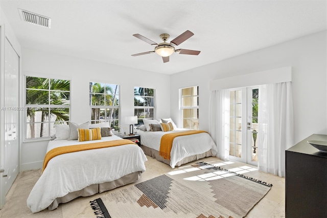 bedroom with french doors, multiple windows, visible vents, and access to exterior