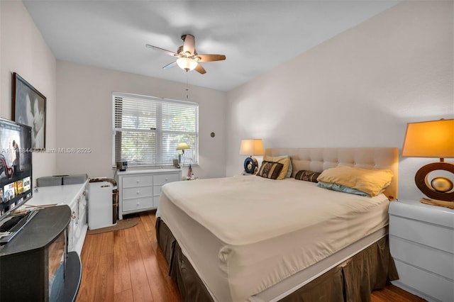 bedroom with ceiling fan and wood finished floors