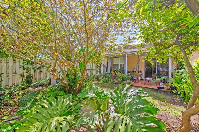 view of yard with fence and a patio