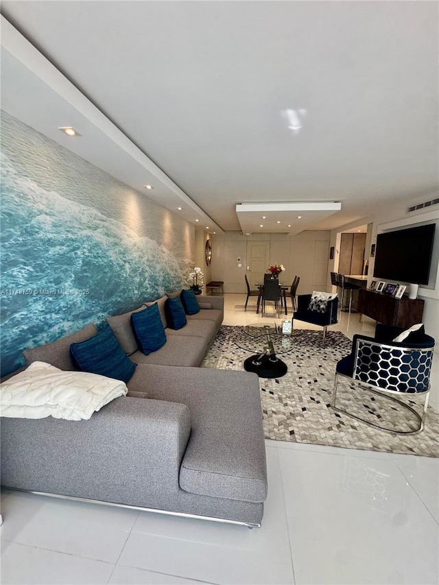 living room with recessed lighting, visible vents, and light tile patterned floors