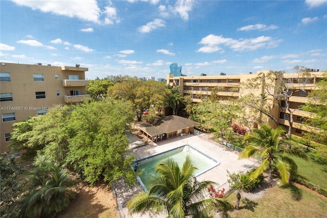 community pool with a patio and a gazebo