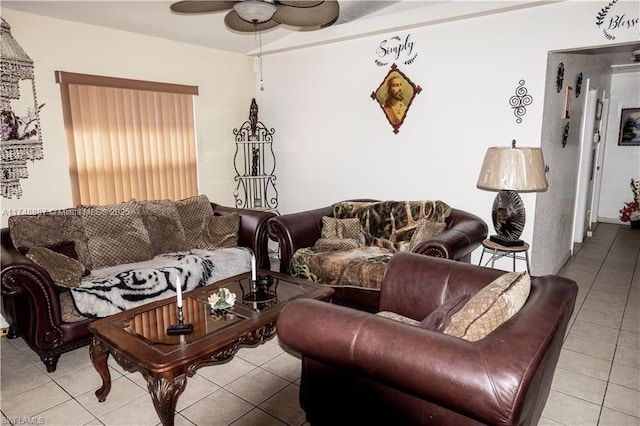 living area featuring ceiling fan and light tile patterned floors