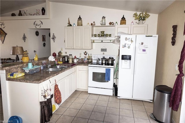 kitchen featuring white appliances, dark countertops, a sink, and white cabinets