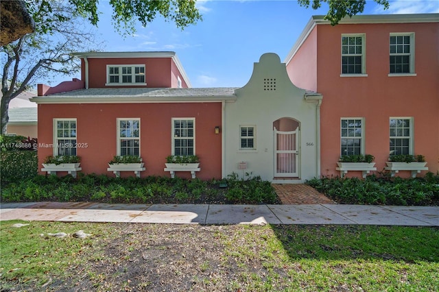 view of front of house featuring stucco siding