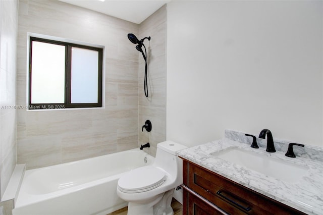 bathroom with toilet, bathtub / shower combination, and vanity