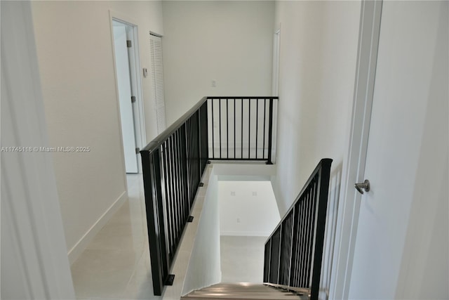 stairway featuring baseboards