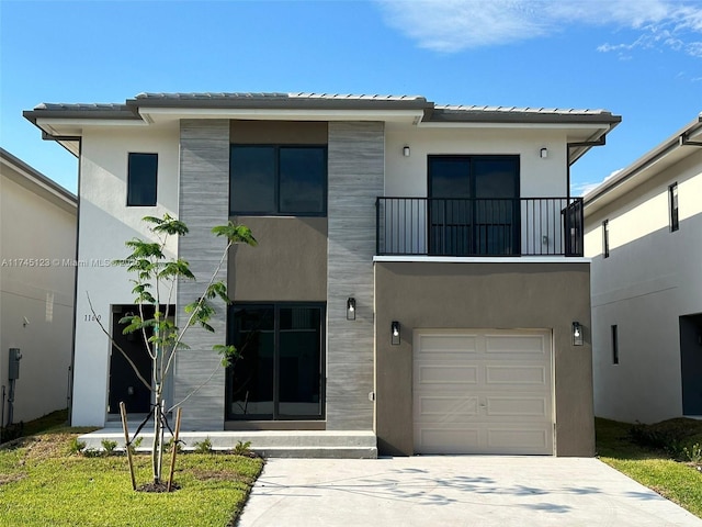 contemporary home with concrete driveway, a balcony, a tile roof, an attached garage, and stucco siding