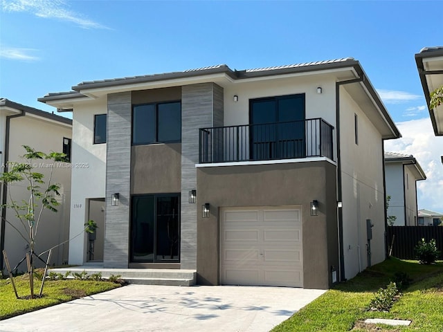 view of front facade with stucco siding, an attached garage, fence, a balcony, and driveway