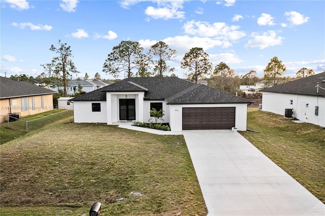 view of front of property with a garage, concrete driveway, fence, central air condition unit, and a front yard