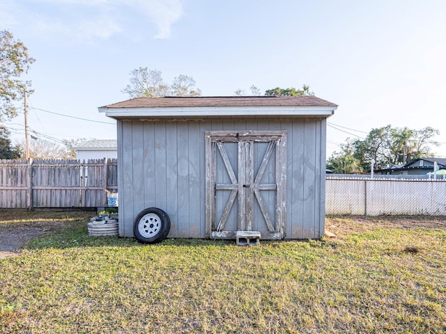 view of shed with fence