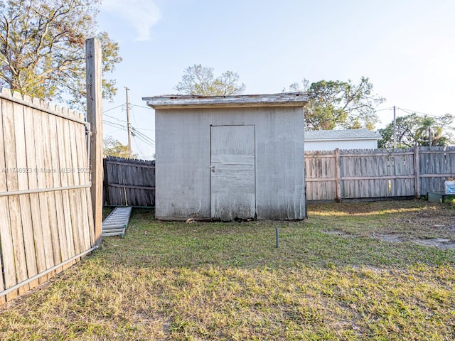 view of shed featuring a fenced backyard