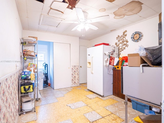 interior space featuring ceiling fan, light floors, and white refrigerator with ice dispenser