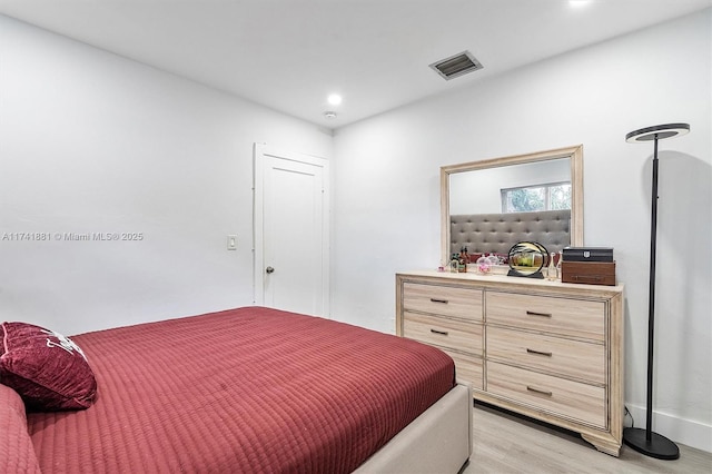 bedroom featuring recessed lighting, visible vents, and light wood-style floors