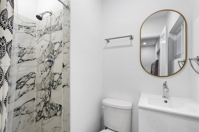 full bathroom featuring toilet, a stall shower, and vanity