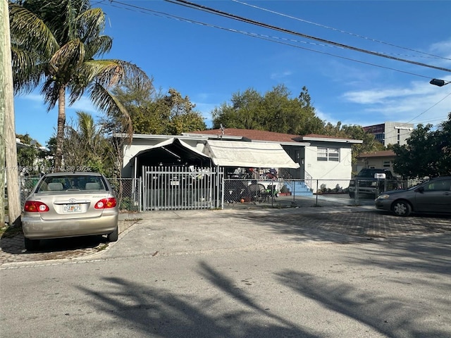 view of parking featuring fence