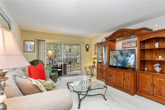 living area with light carpet and a textured ceiling