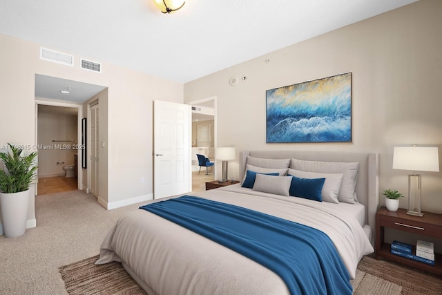 bedroom with carpet, a closet, visible vents, and baseboards