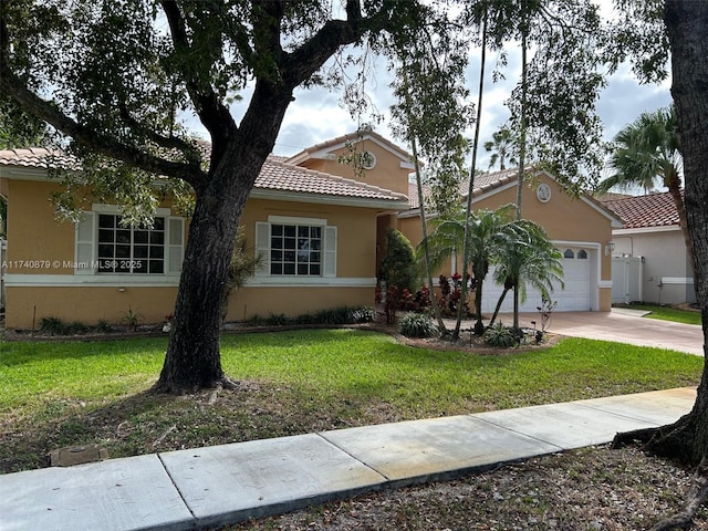 view of front facade featuring a tile roof, stucco siding, concrete driveway, a garage, and a front lawn