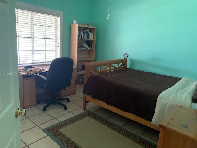 bedroom featuring light tile patterned flooring