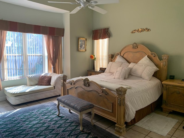 bedroom with a ceiling fan and light tile patterned flooring