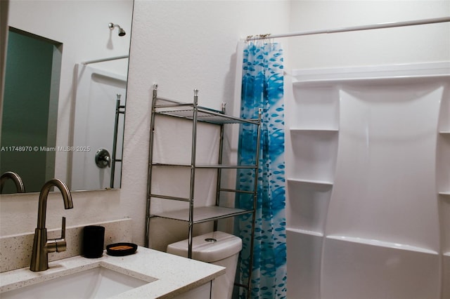 bathroom with toilet and vanity