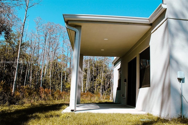 exterior space featuring stucco siding