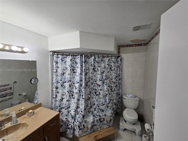 8485 SW 156th Pl Unit 106, Miami, FL 33193 - full bath with toilet, tile patterned floors, a textured ceiling, vanity, and curtained shower