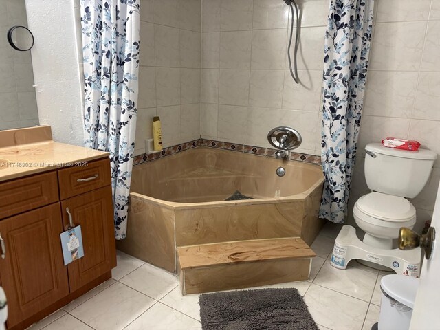8485 SW 156th Pl Unit 106, Miami, FL 33193 - full bathroom featuring tile walls, shower / bath combo with shower curtain, toilet, vanity, and tile patterned floors