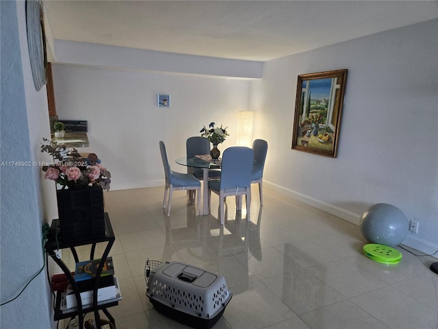 tiled dining area with baseboards