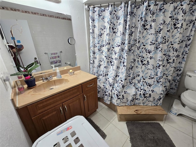 full bath featuring toilet, curtained shower, tile patterned flooring, and vanity