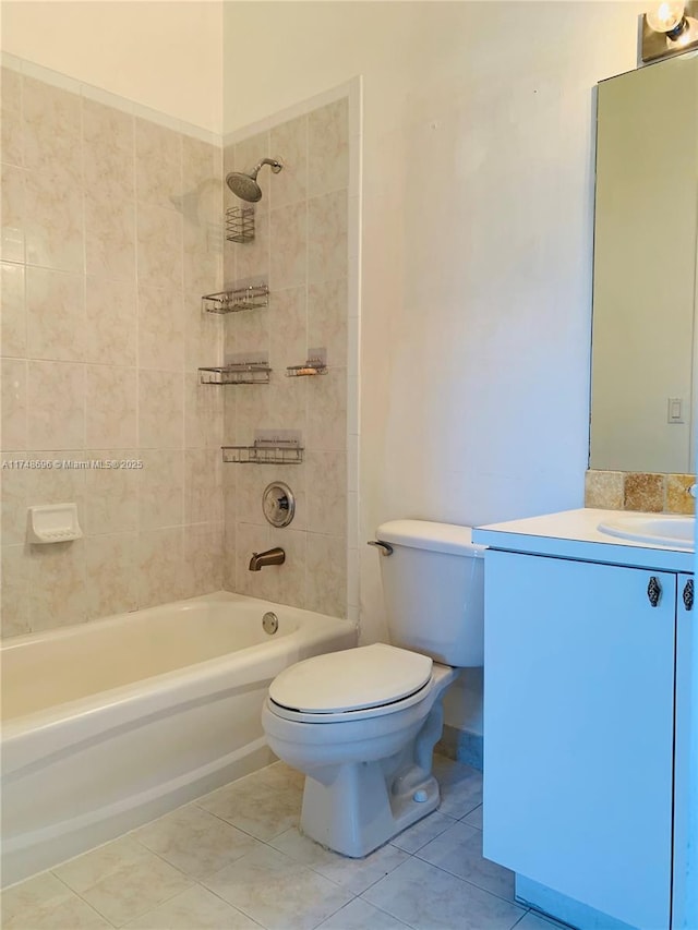 bathroom with vanity, tub / shower combination, tile patterned flooring, and toilet