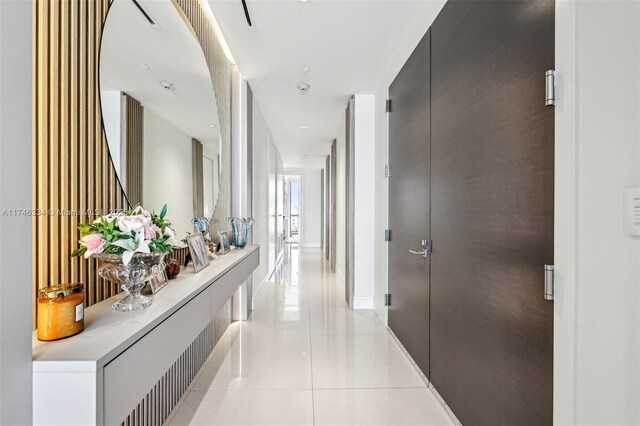 corridor featuring light tile patterned flooring