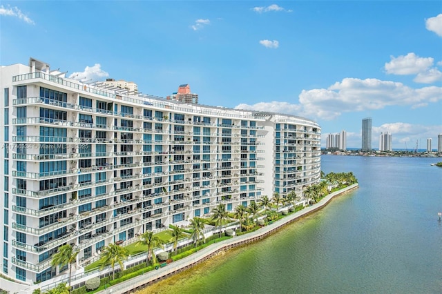 view of property featuring a water view and a city view