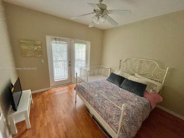 bedroom featuring baseboards, ceiling fan, access to exterior, french doors, and light wood-type flooring