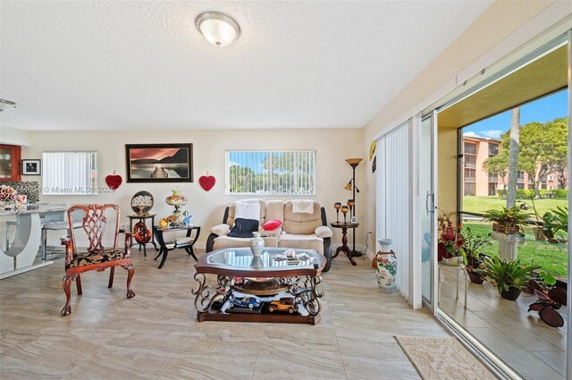 801 Sw 141 101O, Pembroke Pines, FL 33027 - living room featuring a textured ceiling
