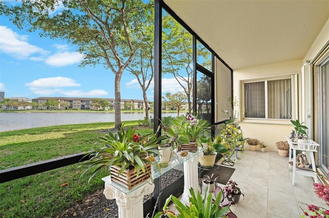 801 Sw 141 101O, Pembroke Pines, FL 33027 - sunroom featuring a water view and tile patterned floors