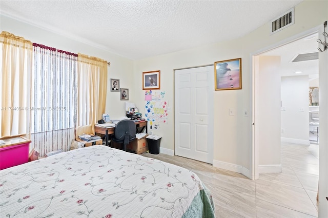 801 Sw 141 101O, Pembroke Pines, FL 33027 - bedroom featuring baseboards, a textured ceiling, and visible vents